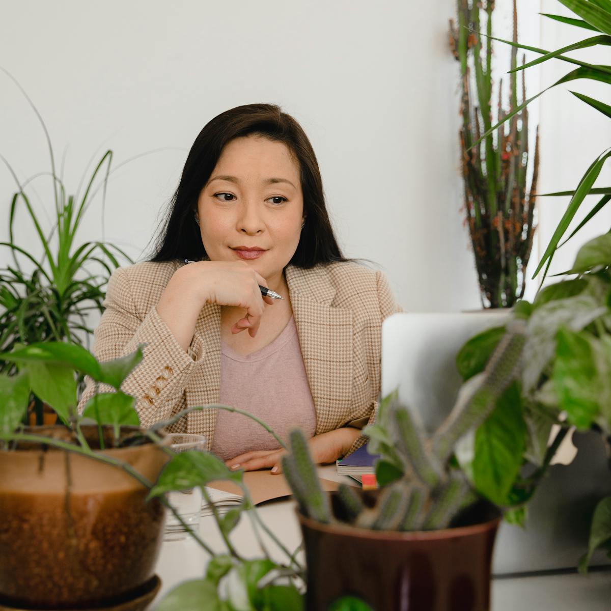 Professional woman working at a desk in a modern office
